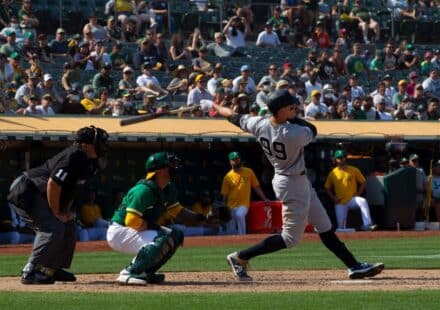 baseball player hitting home run for MLB HR prop bets