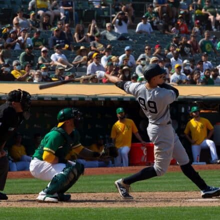 baseball player hitting home run for MLB HR prop bets