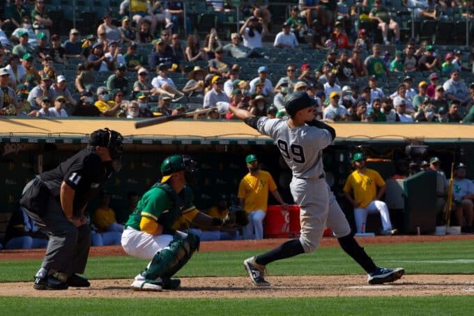 baseball player hitting home run for MLB HR prop bets